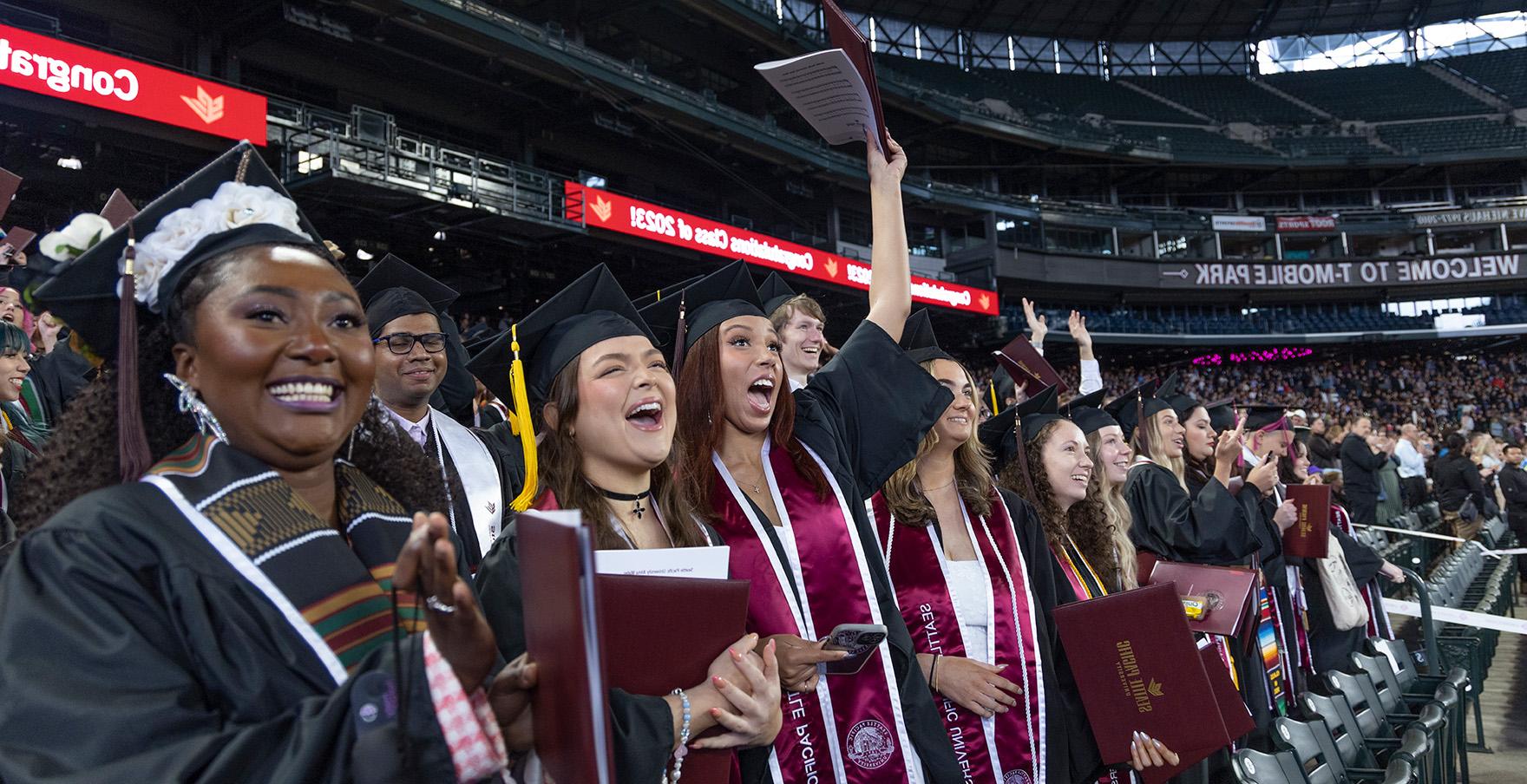 SPU graduates cheer at the Commencement ceremony at T-Mobile Park | photo by Mike Siegel